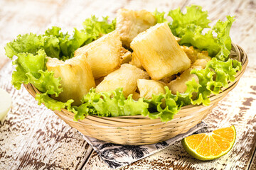 fried cassava with vegetables and sauces, a typical Brazilian snack served in restaurants and bars