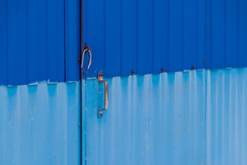 metal blue door outdoors close-up