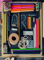 Blackboard with various art and craft tools