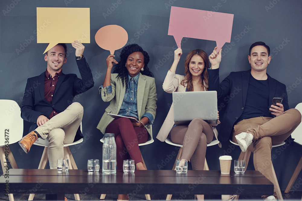 Poster Our opinions will lead us to success. Shot of a group of businesspeople holding up speech bubbles and using different wireless devices while waiting in line for an interview.