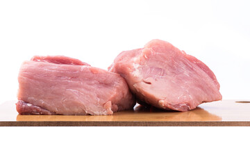 Juicy red meat on a cutting board over white background.