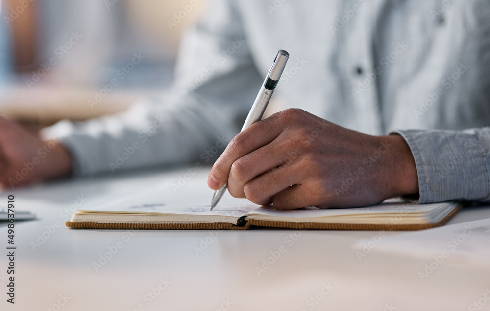 Poster planning and productivity go hand in hand. shot of an unrecognisable businessman writing in a notebo