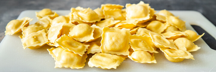 ravioli pasta stuffed square shape italian dish fresh healthy meal food snack diet on the table copy space food background rustic top view
