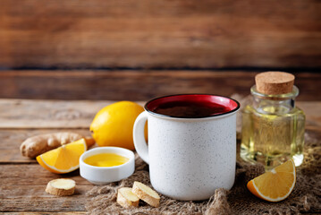 Cup of black tea with honey, lemon and ginger