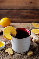 Cup of black tea with honey, lemon and ginger