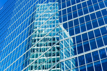 Light reflection in modern office buildings. Modern building facade. Skyscraper city architecture. Warsaw.