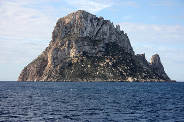 Fototapeta na wymiar The small Balearic rocky islet of Es Vedra in the Ibiza Sea