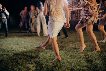 feet of dancing people in a disco at a banquet