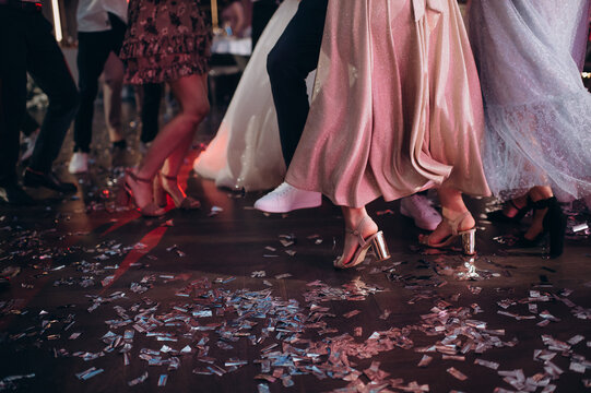 Feet Of Dancing People In A Disco At A Banquet