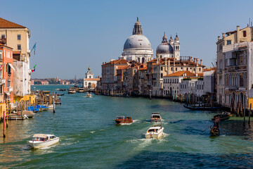 Fototapeta premium Boat traffic on the Grand Canal of Venice looking towards Salute from the Accademia area
