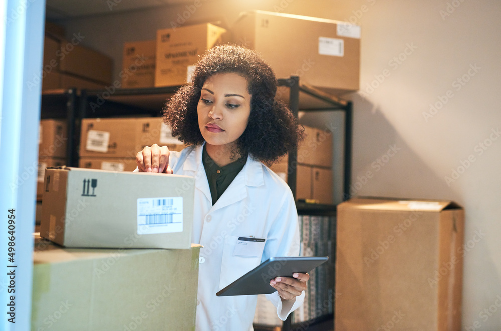 Poster coordinating the stock control process with smart technology. shot of a young woman using a digital 