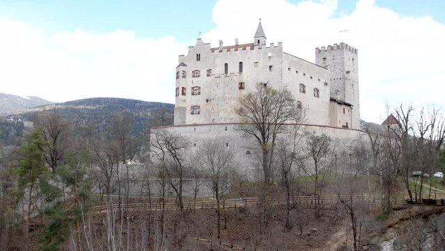 View of the Brunico Castle, situated on the hill over the old town, in Val Pusteria, Italy location of the Messner Mountain Museum