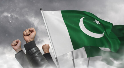 Protests in Pakistan. Raised male fists of protesters and flags of Pakistan in clouds of white smoke. Fight for human rights. Clenched fist - a symbol of resistance