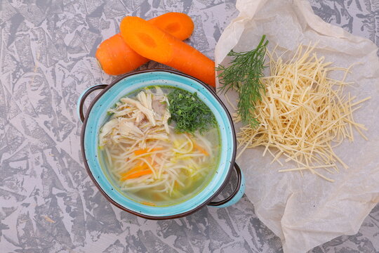 chicken soup with homemade noodles on a rich broth photo for a cafe, restaurant or on the menu