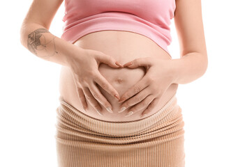 Pregnant woman making heart shape with her hands on belly against white background, closeup