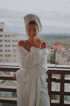 girl in a bathrobe on the balcony on vacation