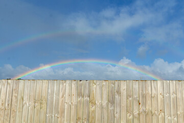 fence and rainbow