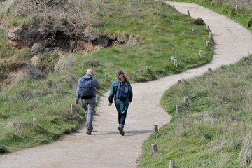 Obraz premium Hikers on the GR34 path in Brittany-France