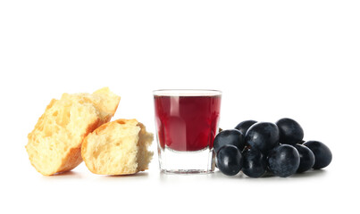Glass of wine with grapes and bread on white background