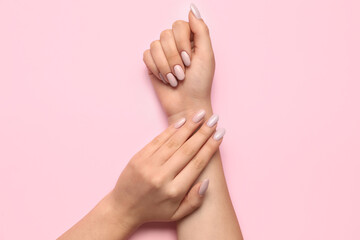 Female hands with beautiful manicure on pink background - obrazy, fototapety, plakaty