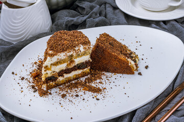 Sour cream chocolate cake on white plate