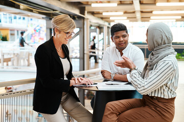 They each have brilliant ideas to share. Shot of a group of businesspeople having a discussion in an office.