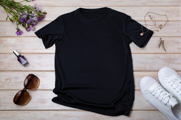 Womens black T-shirt mockup with burdock flowers
