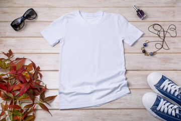 Womens white T-shirt mockup with blue sneakers