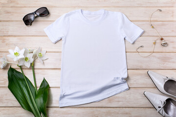Womens white T-shirt mockup with lily flowers, green leaves