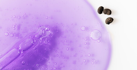 Bakuchiol serum transparent texture with pipette and bakuchiol seeds,macro. Bakuchiol cosmetic...