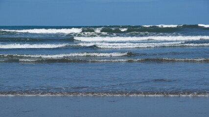 Waves breaking on the beach in Canoa, Ecuador