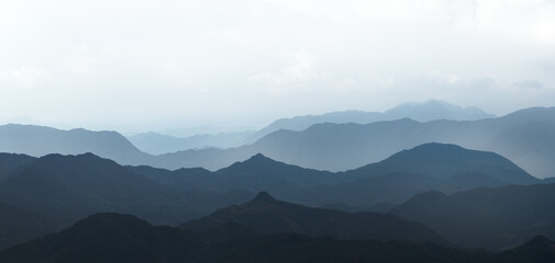 Chinese painting style blue tone ink mountains.