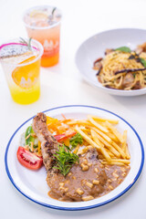 grilled pork chop serve with french fried