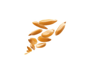 Flax seeds are levitated on a white background