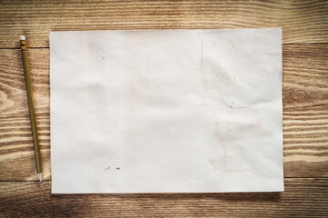 Sheet of paper lying on wooden table