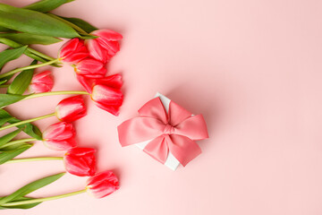 Greeting card. Bouquet of colorful tulip flowers gift box on pink, copy space, invitation card. Spring time seasonal holiday, 8 march International woman day, Mother day, banner, flyer