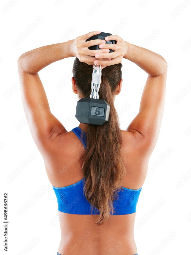 Wall mural Getting back to fitness. Rearview shot of a young woman working out with dumbbells against a white background. - Wall murals
