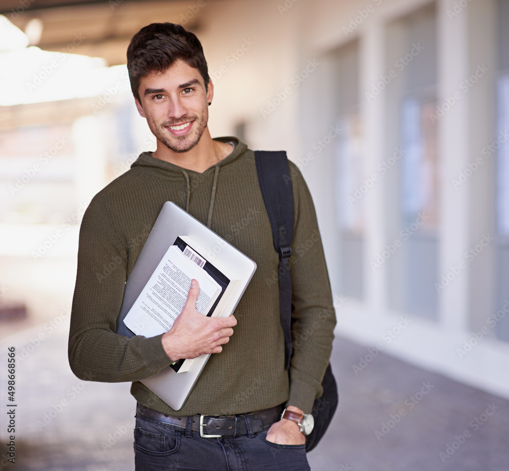 Poster education is the movement from darkness to light. cropped portrait of a handsome young man standing 