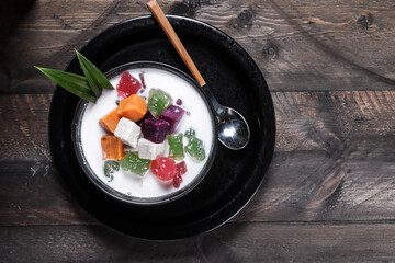 Bubur Cha Cha or chacha, Malaysian style coconut milk dessert with taro, sweet potato, yam, tapioca and a variety of condiments