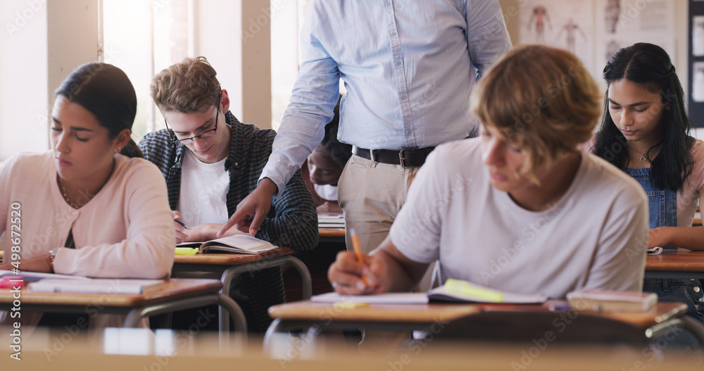 Poster make today the day you learn something new. shot of teenage boy asking his teacher for help during a