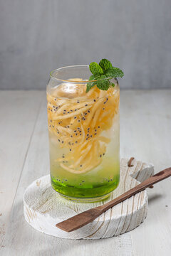 Es Blewah. Indonesian cold fruity drink of cantaloupe strips with syrup, basil seeds on top;