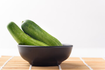 Fresh cucumber on white background