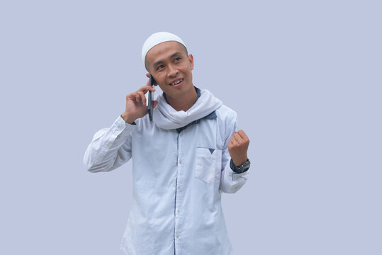 happy muslim man talking on the phone