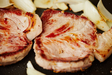 Meat and vegetables cooked in a cast iron pan