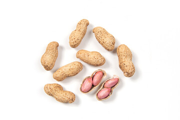  raw unpeeled peanut nuts isolated on white background. 