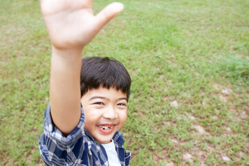 Cute boy laughing while looking at camera, Happy and smiling child.