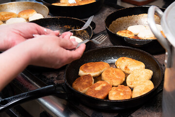 cooking fried pies with potatoes and cabbage in the dining room kitchen