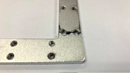 Silver Colour L Plate bracket is damaged.