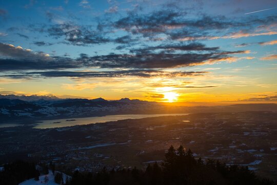 Top view from Bachtel Tower located at Zurich Oberland during Winter sunset time. Panorama view over lake of Zurich