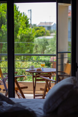 Terrace table with coffee and sandwich.Summer.Breakfast outside by the ocean.Summer vacation in the hotel. Sandwich with coffee and orange juice.Breakfast outside in front of the ocean.Dinner.Vacation